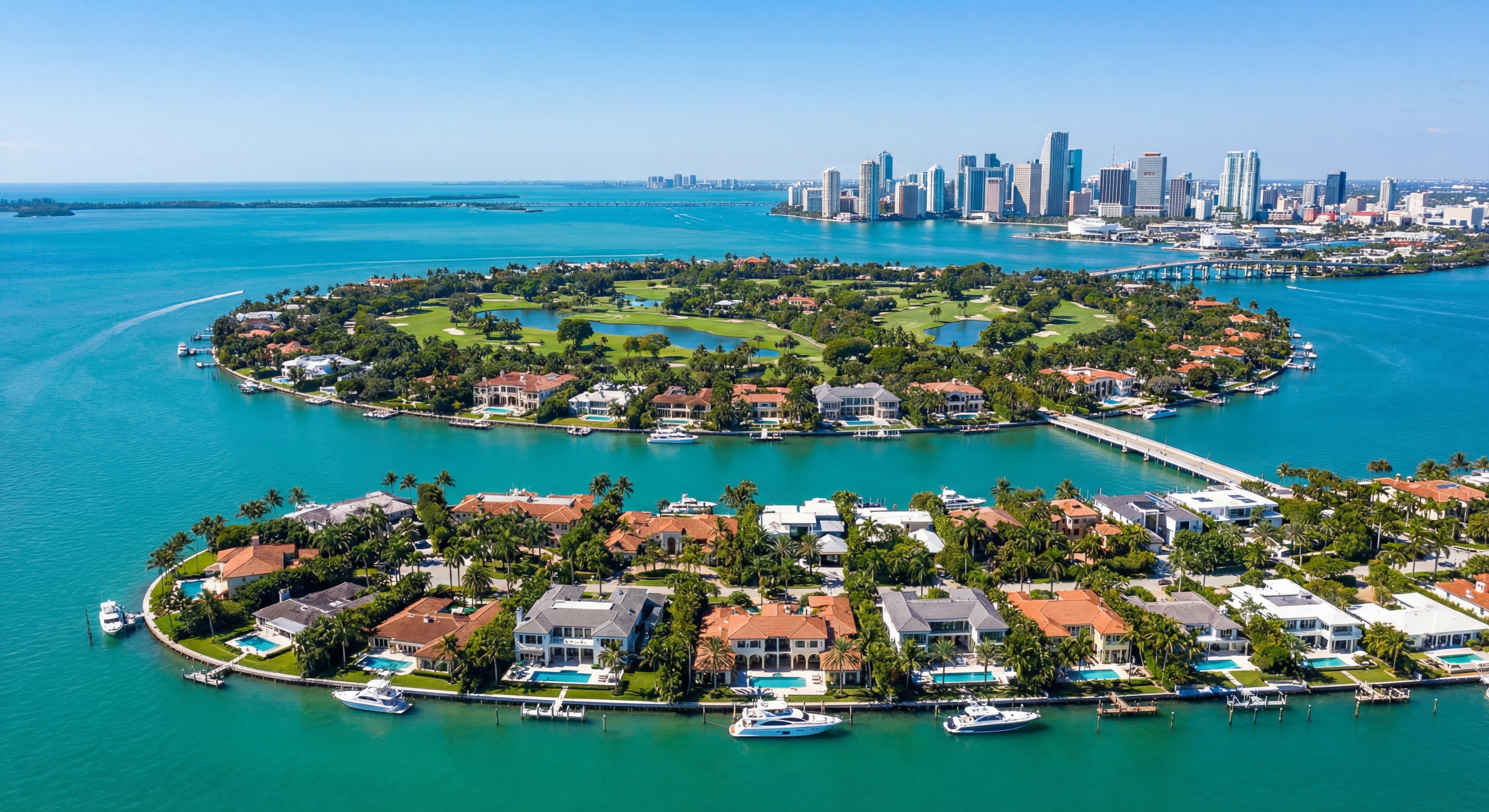 Aerial drone view of Indian Creek Island and Allison Island Miami Beach waterfront estates surrounded by Biscayne Bay
