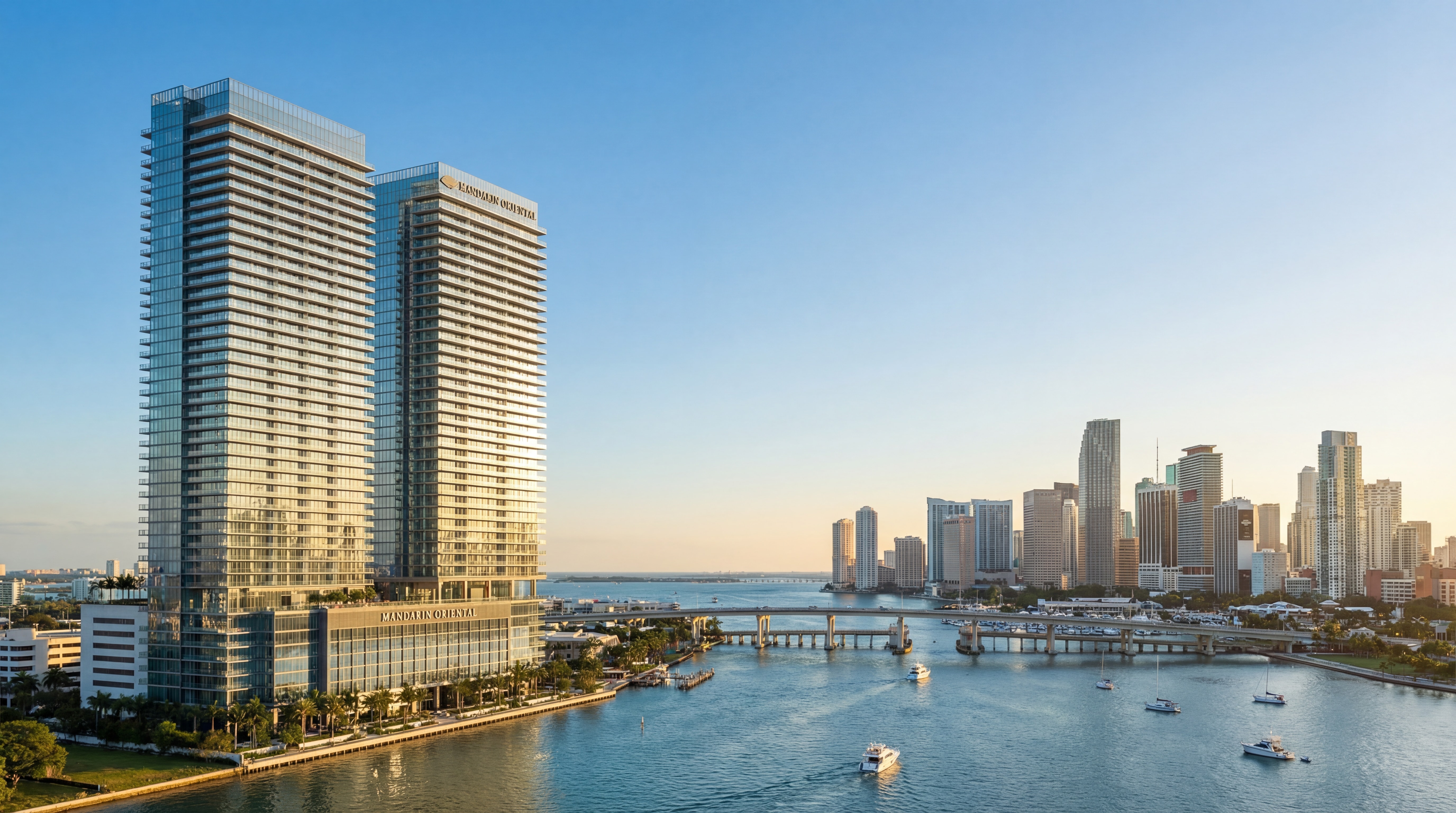 Architectural rendering of The Residences at Mandarin Oriental Miami towers rising above Brickell Key with panoramic Biscayne Bay views