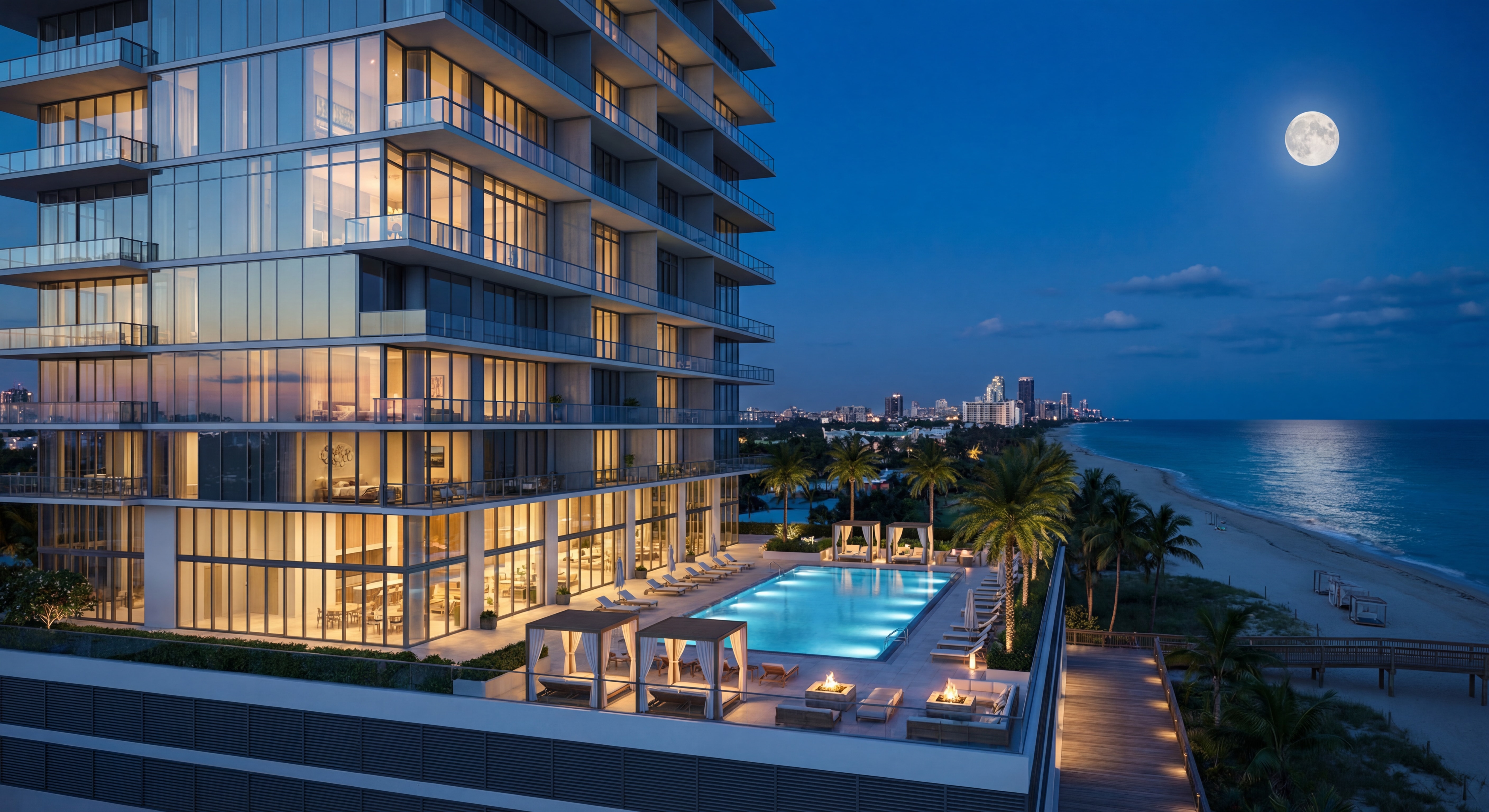 Miami Beach waterfront luxury condo building exterior at night with illuminated pool deck and ocean view