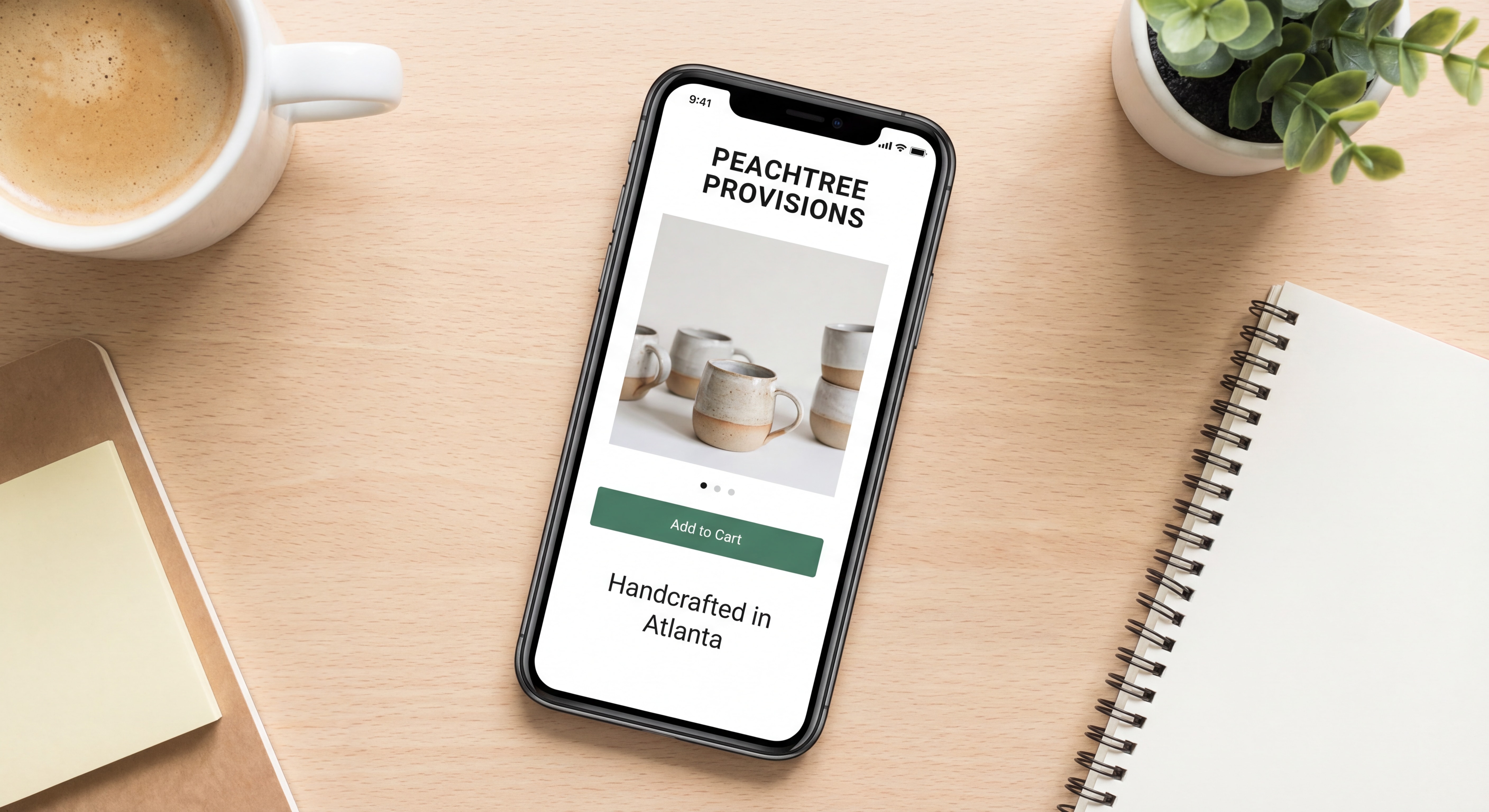 Mobile-first Shopify ecommerce web design showing product page on smartphone with clean Atlanta brand aesthetic