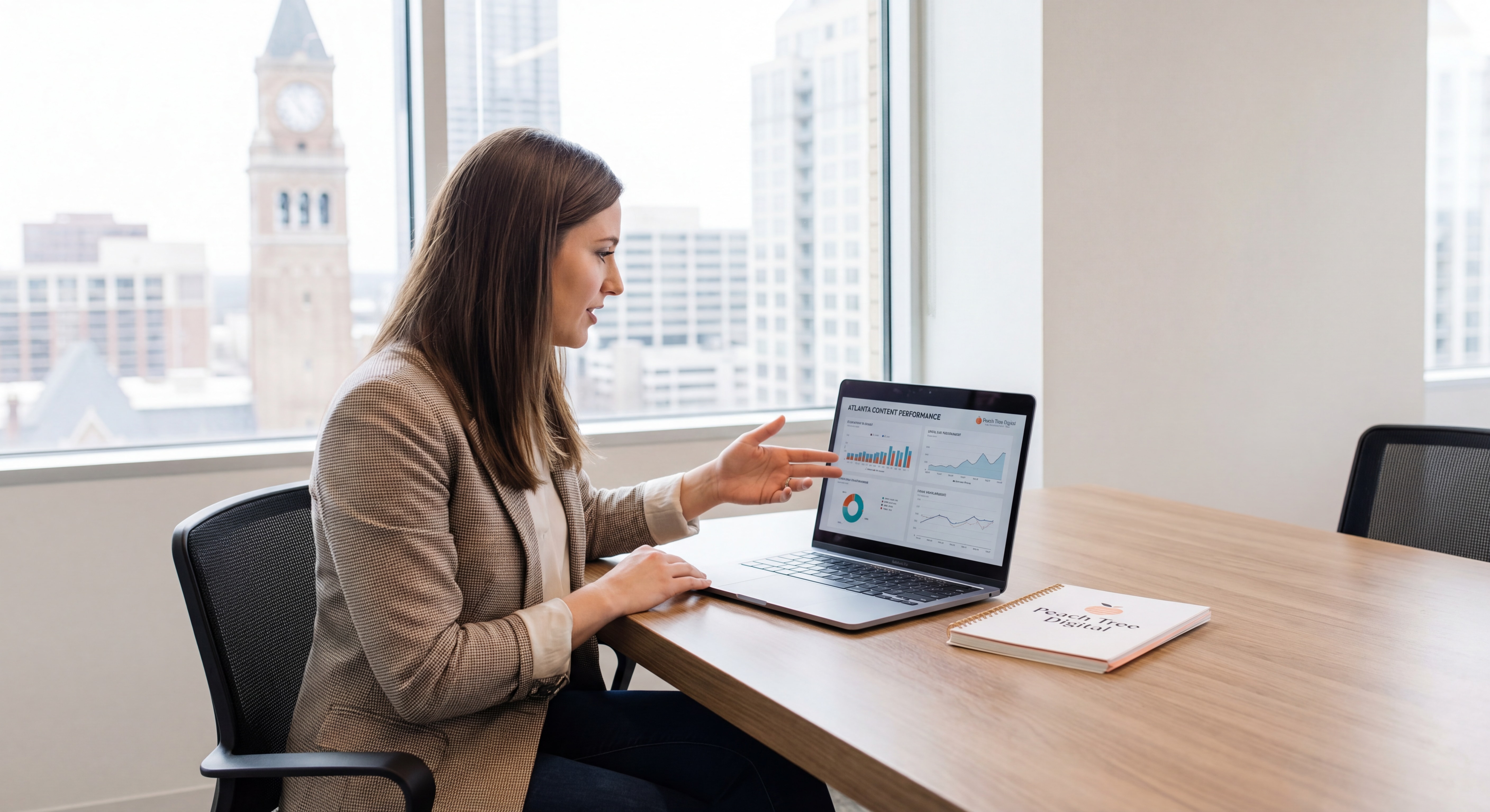 Atlanta business owner reviewing content marketing analytics and SEO audit data on a laptop, representing the intersection of content strategy and local SEO for Atlanta companies
