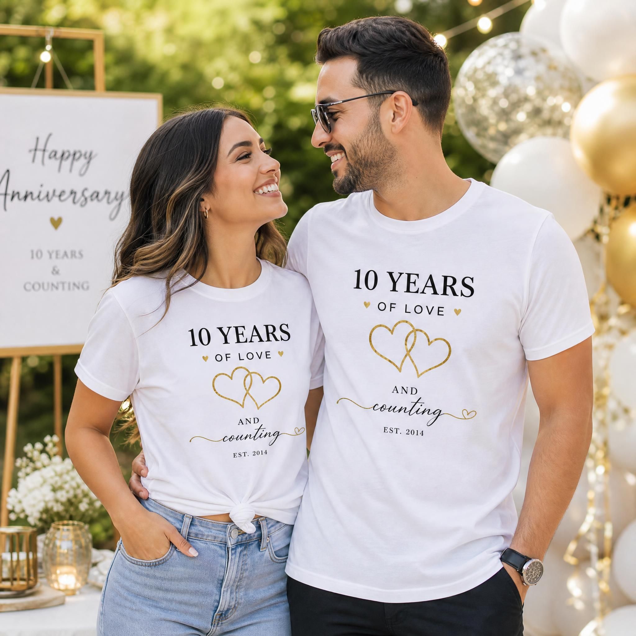 Couple wearing matching custom anniversary shirts outdoors during a celebration