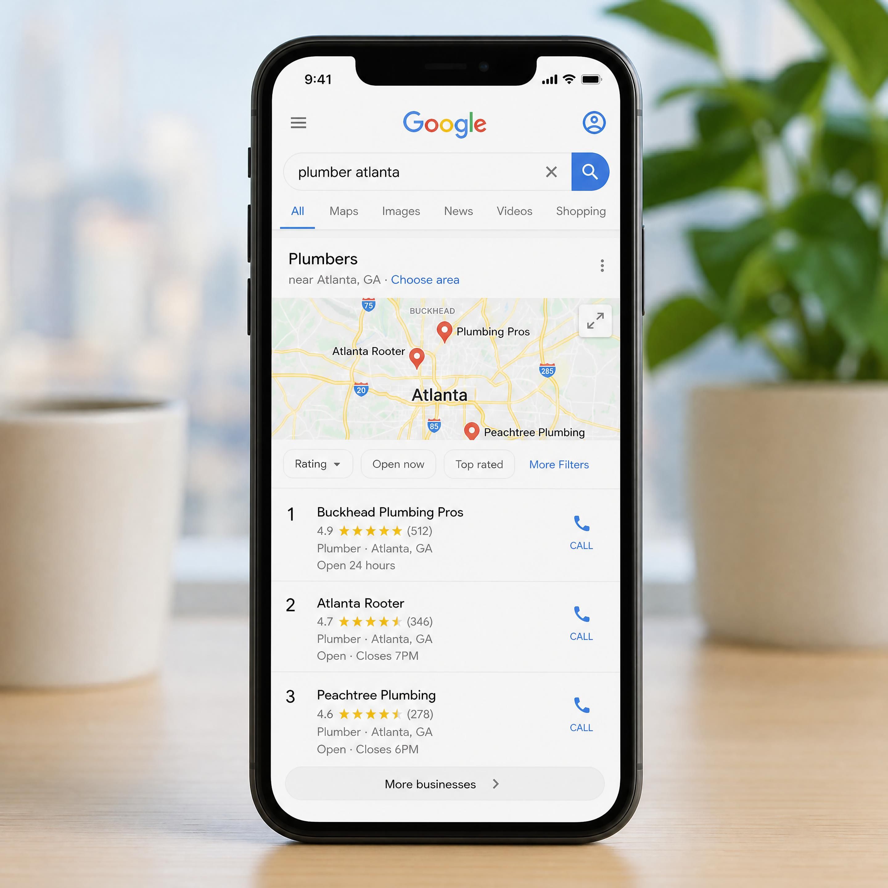 A smartphone displaying a local Google Maps search result with 3-pack rankings in Atlanta