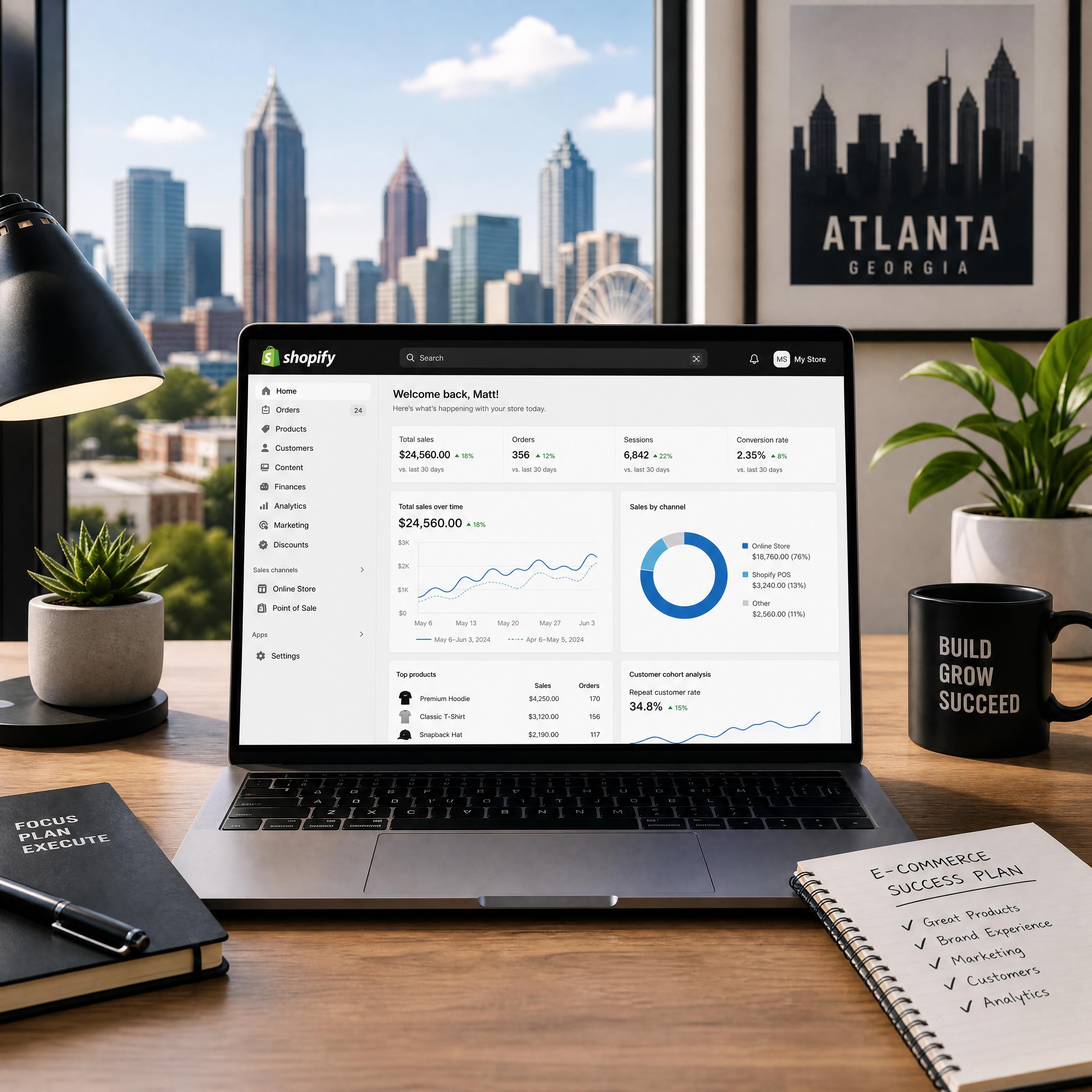 A modern workspace in Atlanta with a laptop showing a Shopify store backend and analytics
